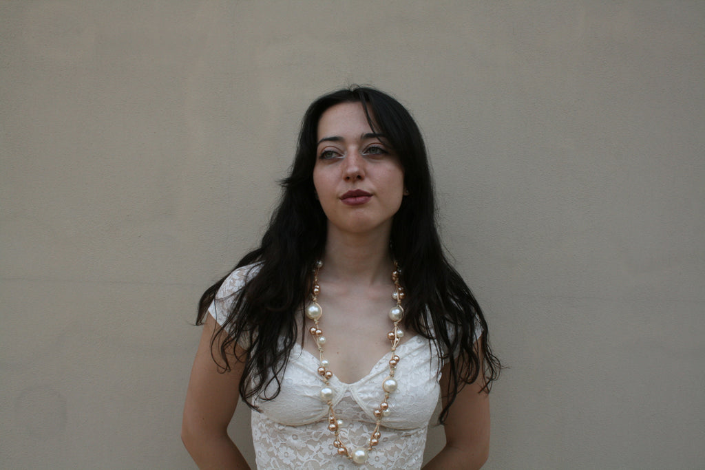 Collana lunga sfumature di perle e bronzo