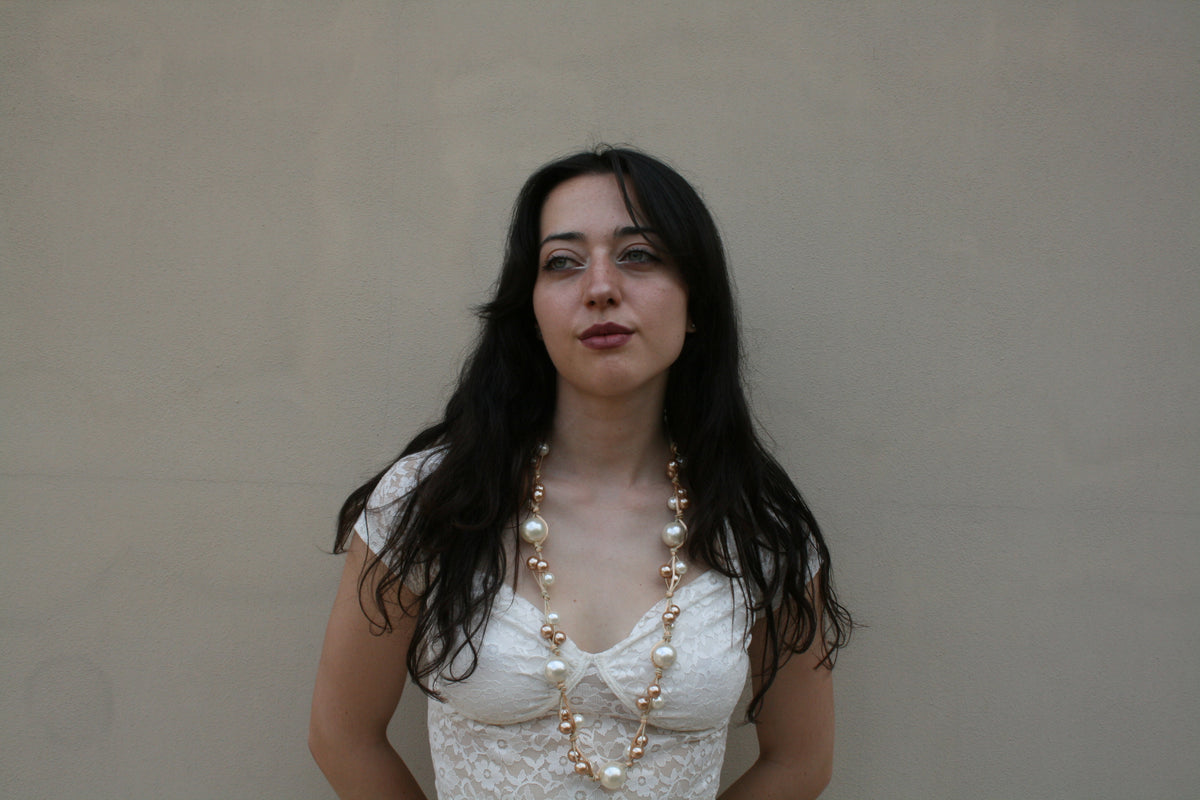 Collana lunga sfumature di perle e bronzo